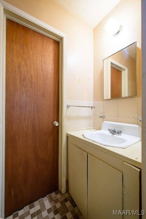 bathroom featuring backsplash and vanity