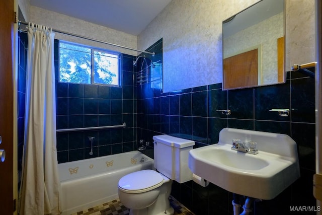 full bathroom with backsplash, shower / bath combination with curtain, sink, toilet, and tile walls