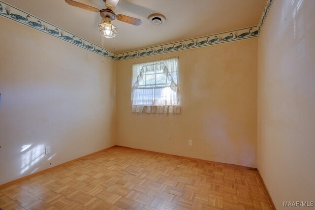 unfurnished room featuring light parquet floors and ceiling fan