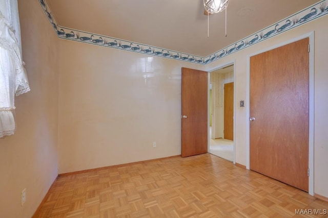 empty room with light parquet flooring