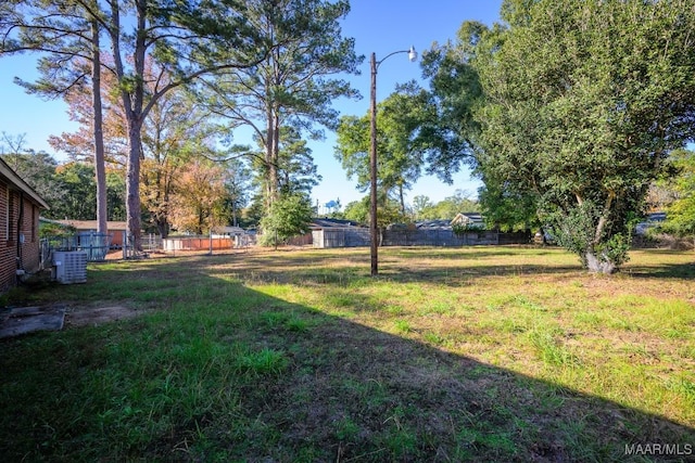 view of yard with central AC unit