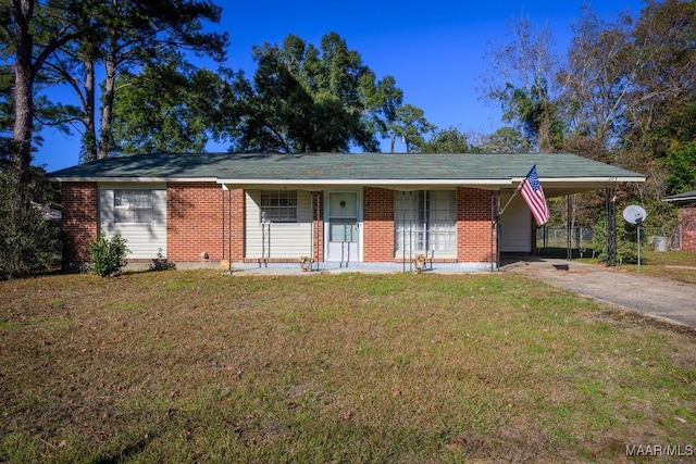 ranch-style home with a front lawn, a porch, and a carport