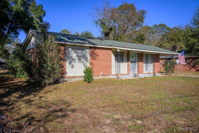 single story home with covered porch and a front lawn