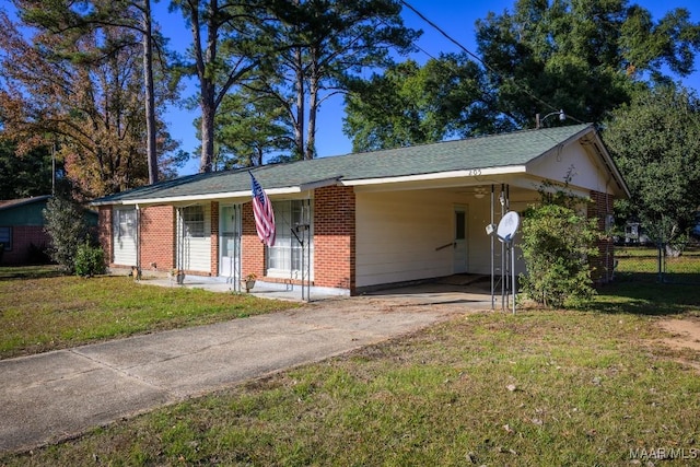 single story home featuring a carport, covered porch, and a front yard