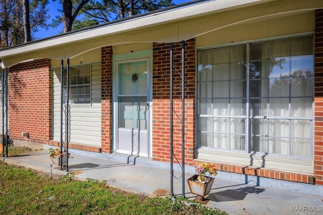 entrance to property featuring a porch