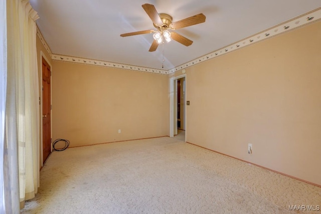 carpeted empty room with ceiling fan