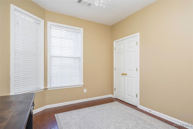 empty room featuring wood-type flooring