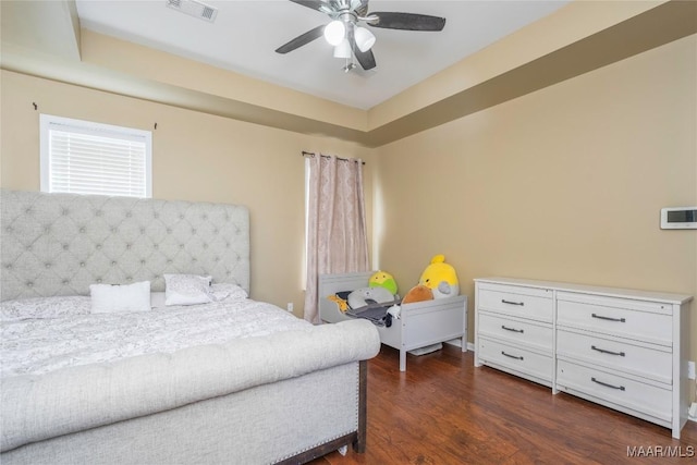 bedroom featuring dark hardwood / wood-style floors and ceiling fan