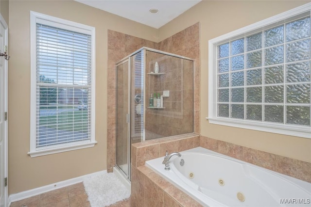 bathroom featuring tile patterned flooring and shower with separate bathtub