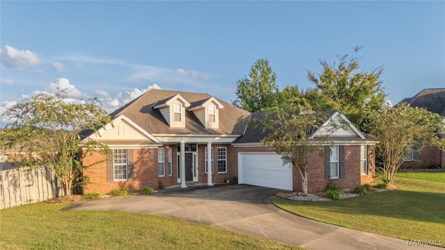 view of front of home featuring a garage and a front yard