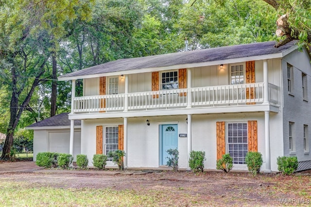 view of front of house with a balcony