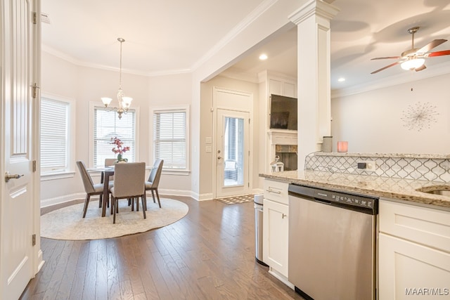 kitchen featuring white cabinetry, dark wood-type flooring, light stone counters, ceiling fan with notable chandelier, and stainless steel dishwasher