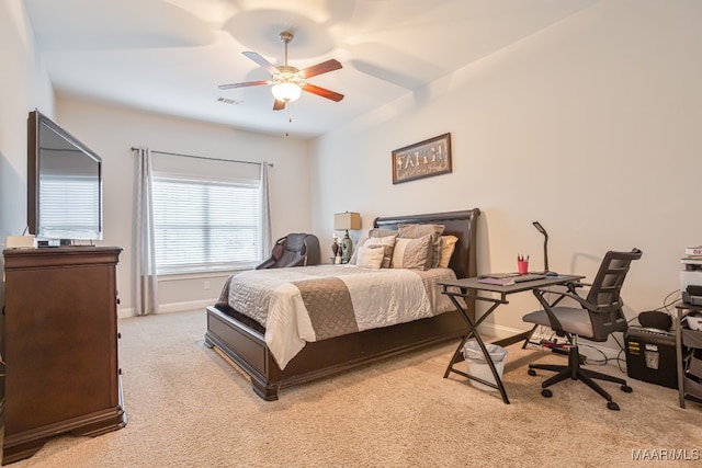 bedroom featuring light carpet and ceiling fan