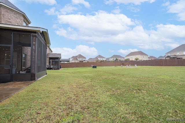 view of yard featuring a sunroom