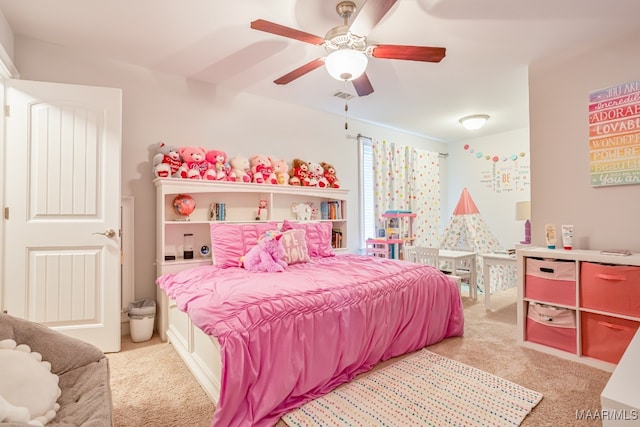 bedroom with ceiling fan and light carpet