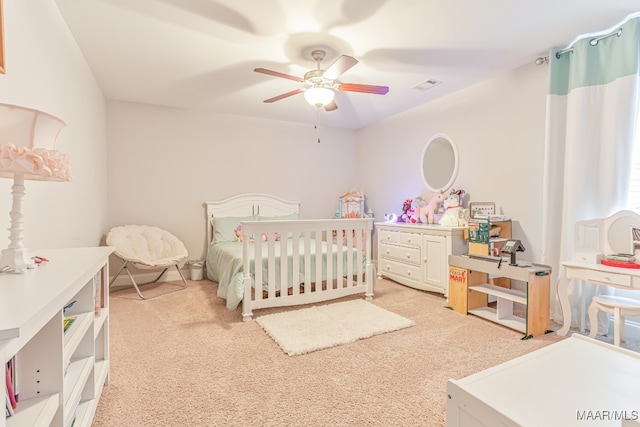 carpeted bedroom with ceiling fan