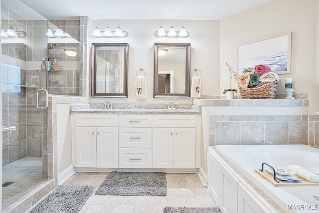 bathroom with plus walk in shower, tile patterned flooring, and vanity