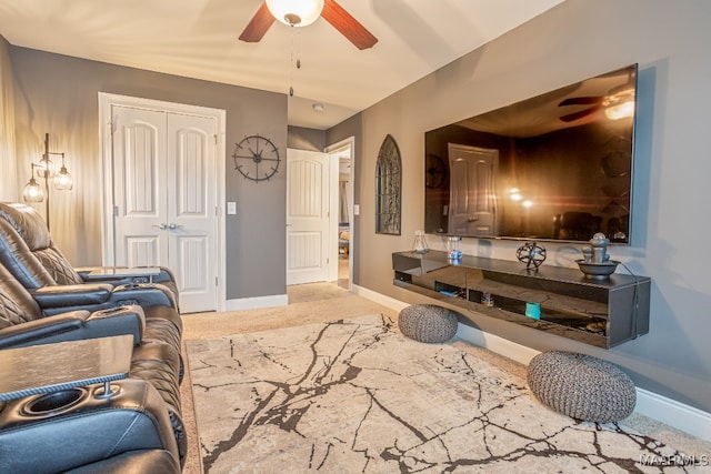 living room with light carpet and ceiling fan