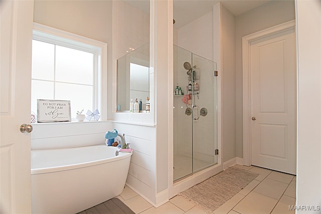 bathroom featuring shower with separate bathtub and tile patterned floors