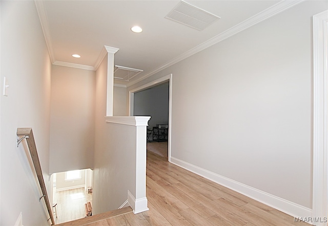 corridor with crown molding and light hardwood / wood-style flooring