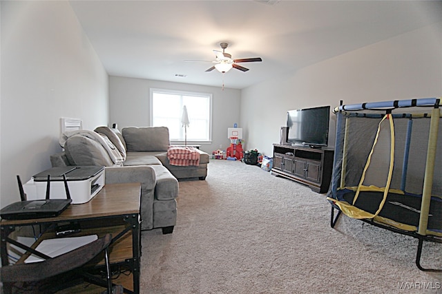 living room featuring carpet floors and ceiling fan