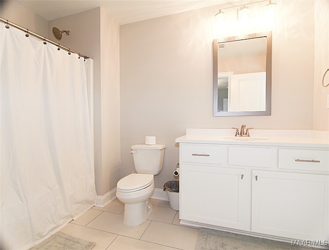 bathroom featuring walk in shower, vanity, toilet, and tile patterned floors