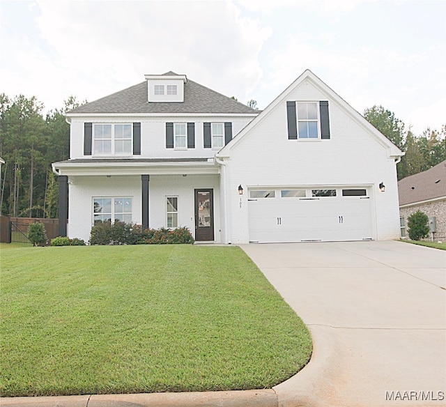 view of front facade with a garage and a front yard