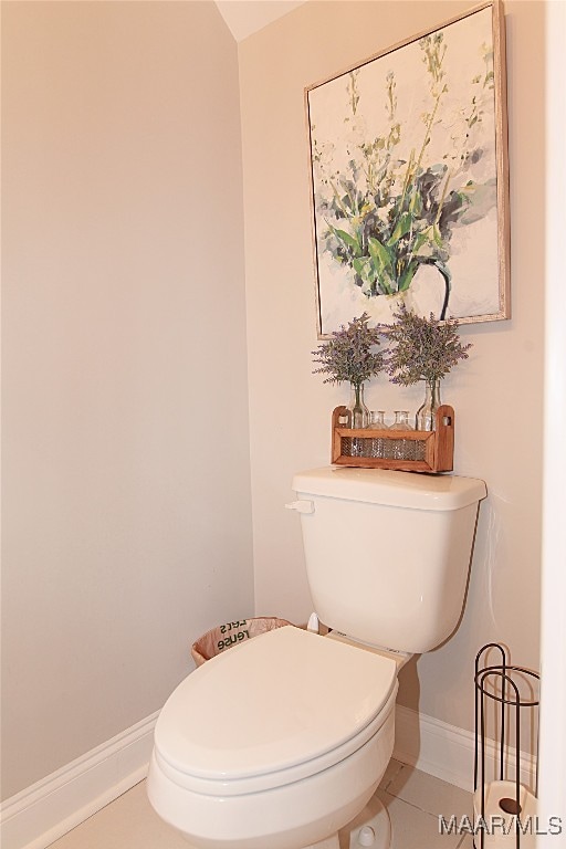 bathroom featuring tile patterned floors and toilet