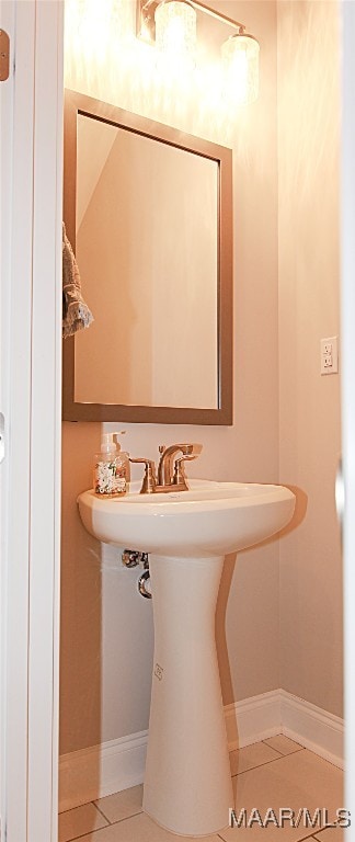 bathroom featuring sink and tile patterned flooring