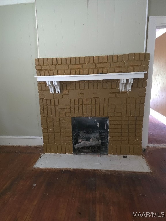 room details with hardwood / wood-style flooring and a fireplace