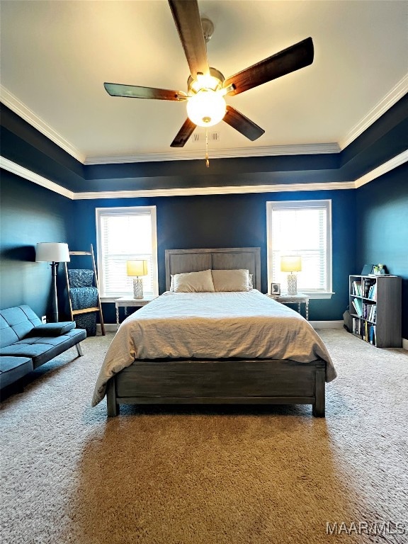 bedroom with multiple windows, crown molding, carpet flooring, and ceiling fan