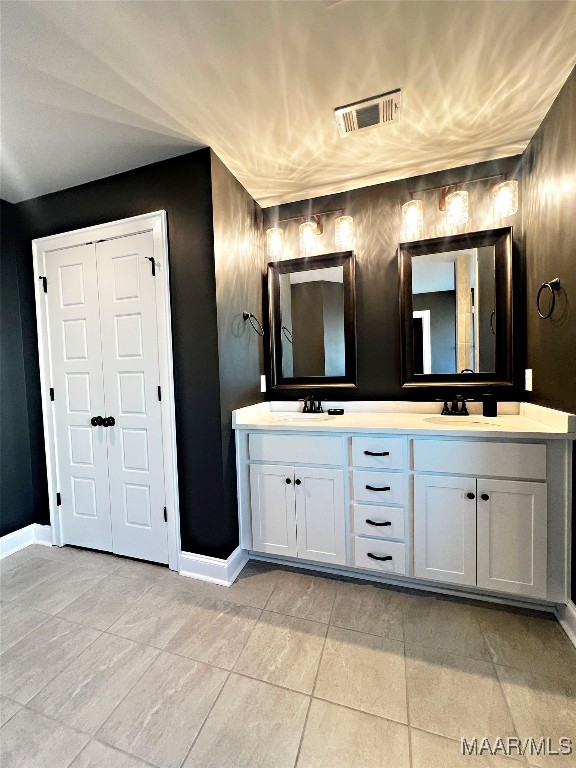 bathroom featuring vanity and tile patterned flooring