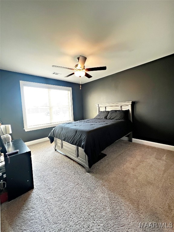 bedroom featuring ceiling fan and carpet floors