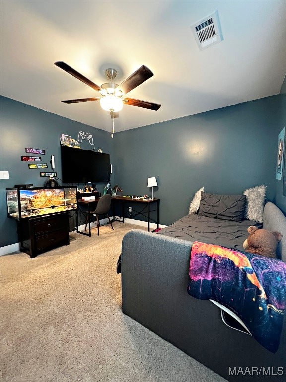 carpeted bedroom with ceiling fan