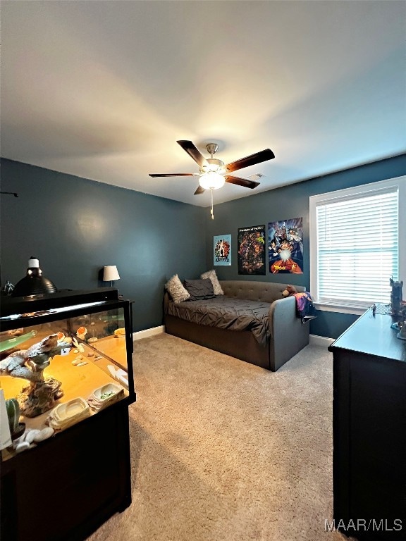 bedroom with ceiling fan and light colored carpet