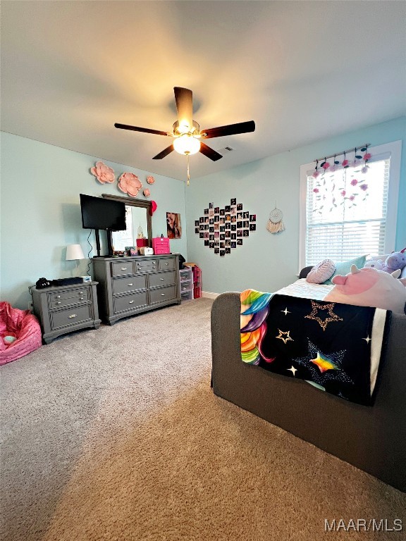 carpeted bedroom featuring ceiling fan