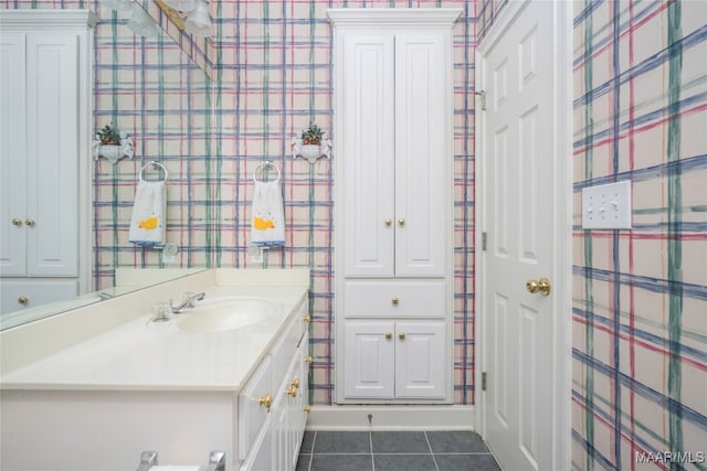 bathroom with tile patterned flooring and vanity