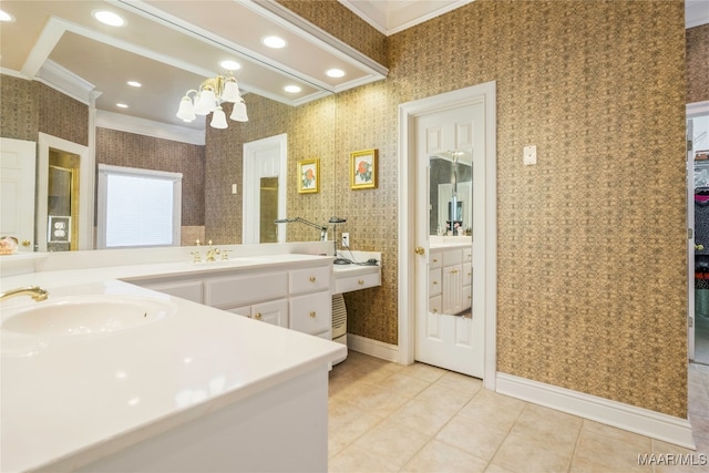 bathroom with tile patterned flooring, a notable chandelier, ornamental molding, and vanity