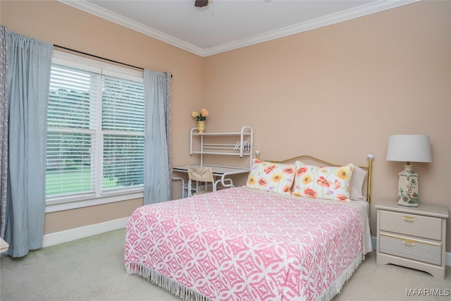 carpeted bedroom featuring ceiling fan and ornamental molding