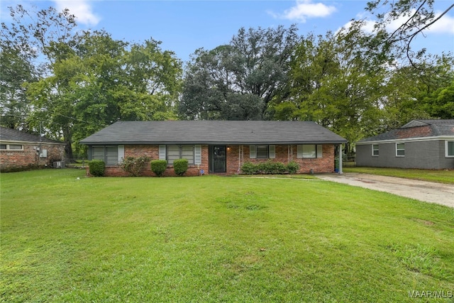 ranch-style house with a front lawn and central air condition unit