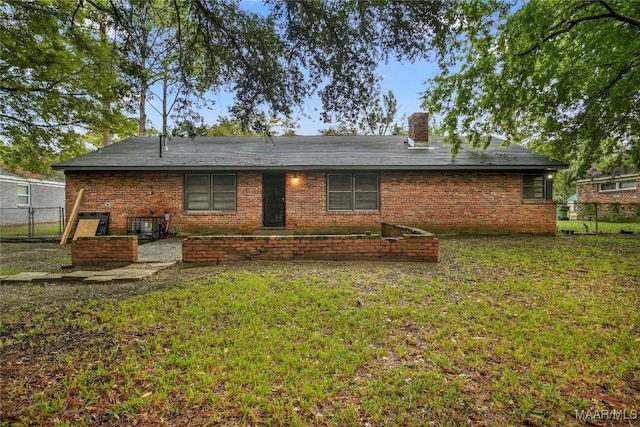 back of house with a yard