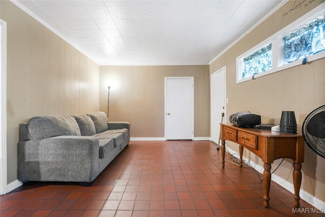 home office featuring crown molding, wooden walls, and dark tile patterned flooring