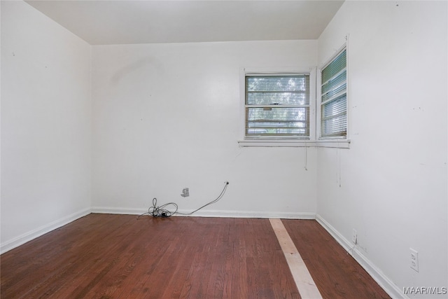 spare room featuring hardwood / wood-style flooring