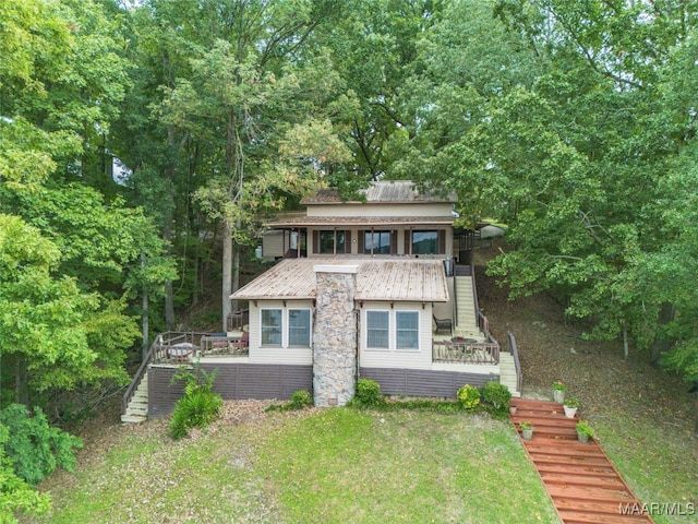 rear view of property with a deck