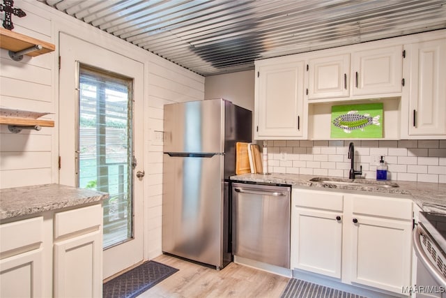 kitchen with white cabinetry, appliances with stainless steel finishes, and sink