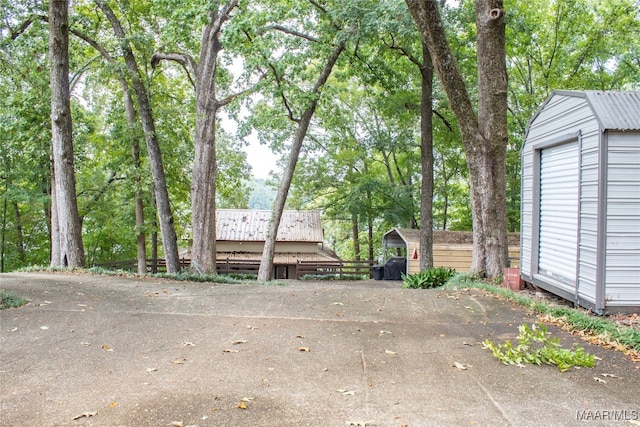 view of patio / terrace with an outdoor structure and a garage