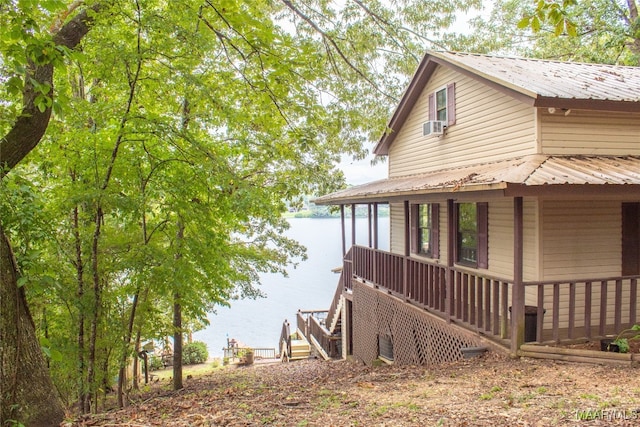 view of side of home featuring a water view