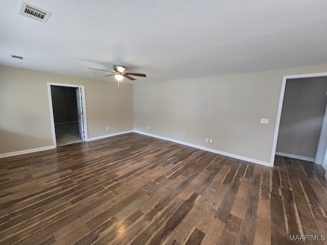 1780 Fitzpatrick Rd, Wetumpka, AL 36092 - spare room featuring a ceiling fan, dark wood-type flooring, baseboards, and visible vents