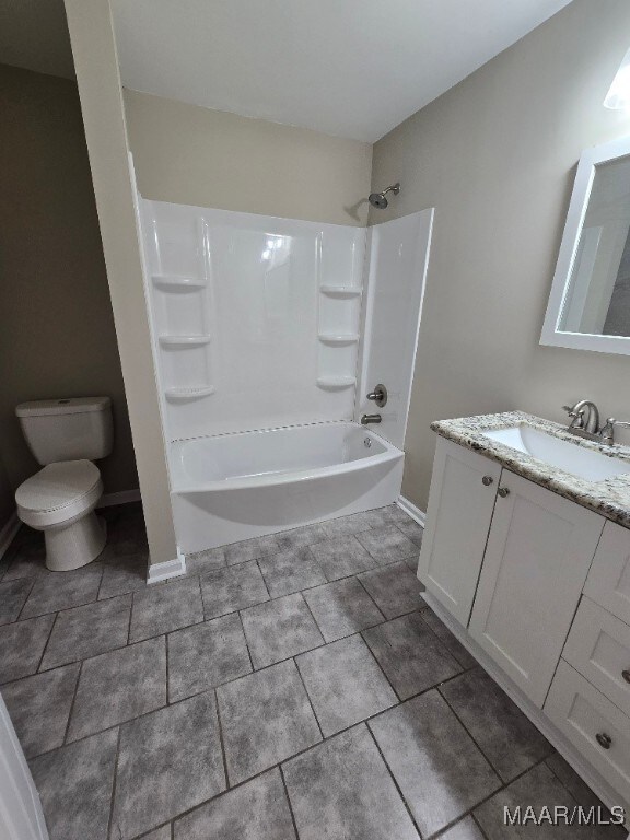1780 Fitzpatrick Rd, Wetumpka, AL 36092 - full bathroom with toilet, vanity, baseboards, and bathing tub / shower combination