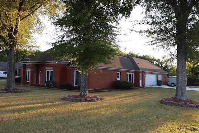 view of front of house with a front lawn and a garage